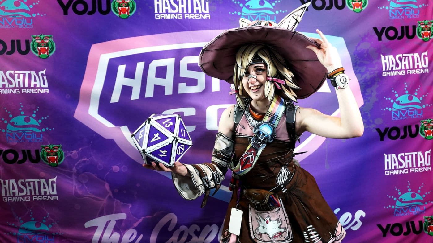 A cosplayer at the HashtagCon photo wall