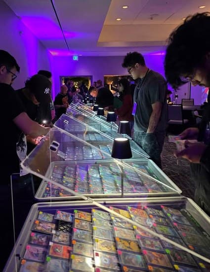 Collectors at the slab cases during the TCG night market